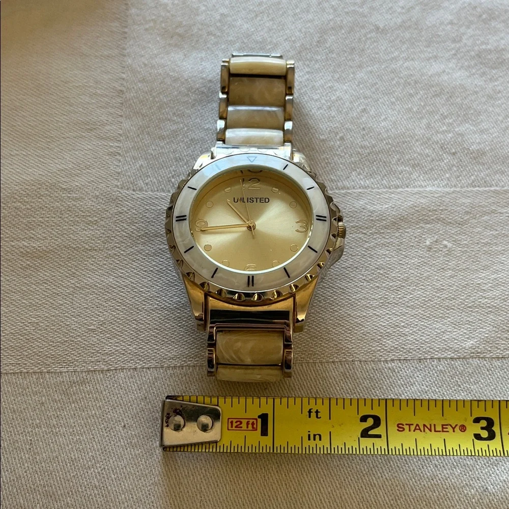 Unlisted by Kenneth Cole Gold-Tone Watch With A Mother-Of-Peal Bracelet Band